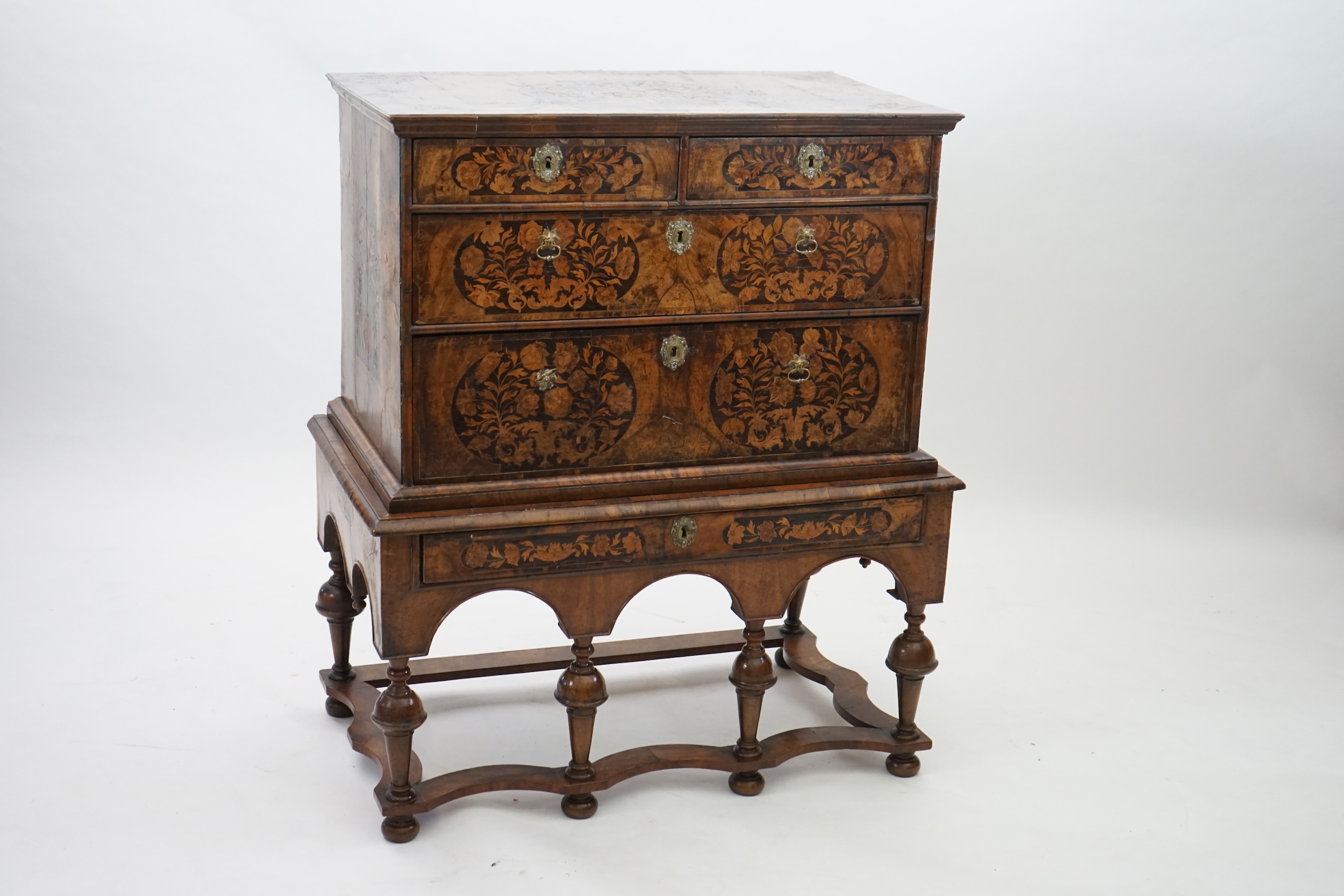 A William and Mary walnut and marquetry chest on stand